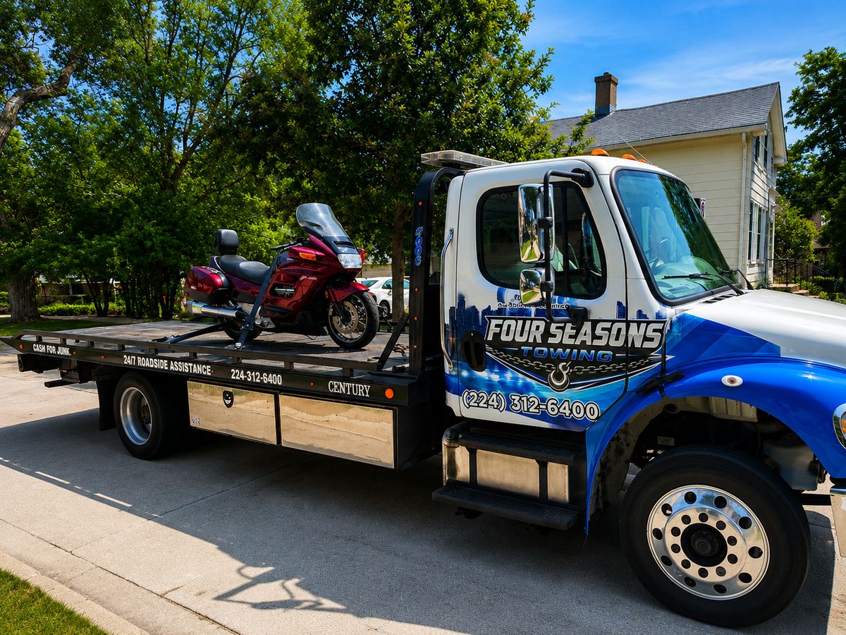 Motorcycle strapped on the Four Seasons flatbed